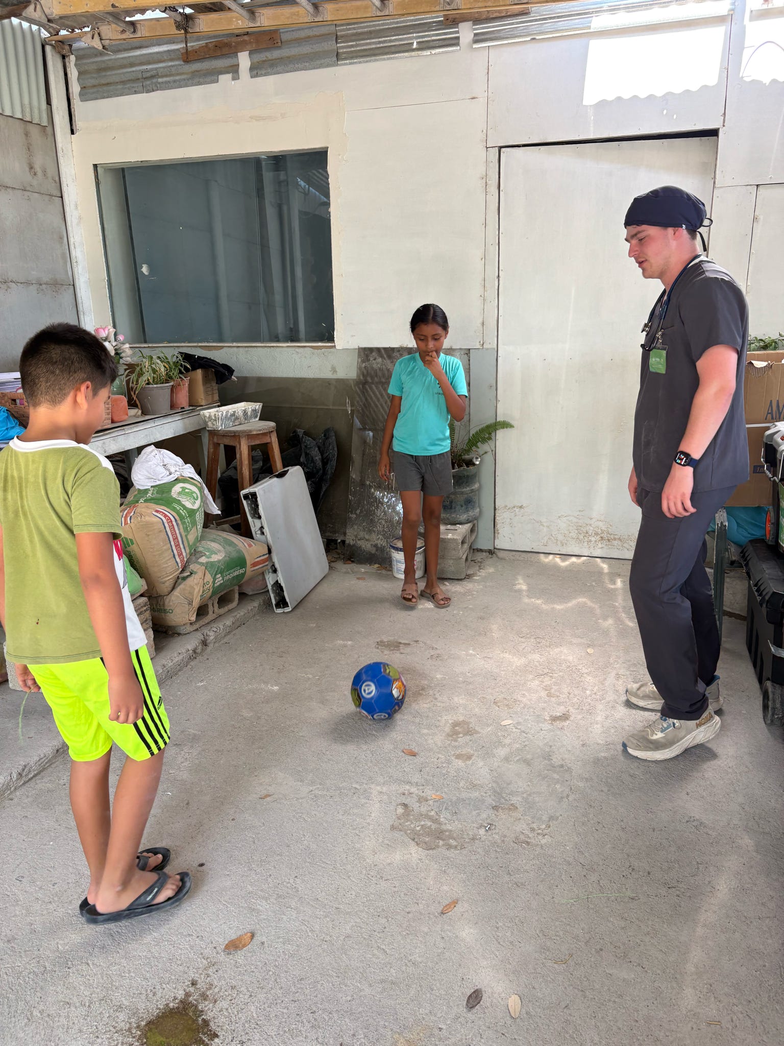 Playing soccer with the kids who lived at the house our clinic was at.