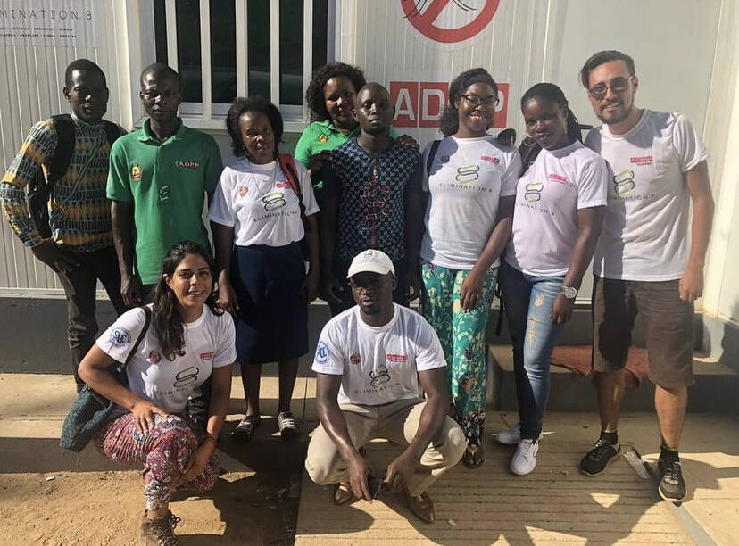 A group of volunteers smile for the camera.