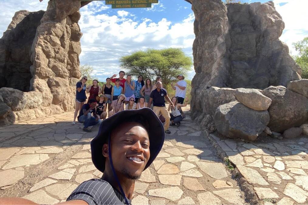 A person taking a selfie with a group of friends in the country