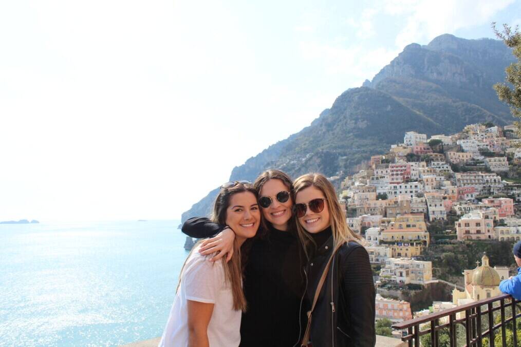 Three friends next to the sea in Spain