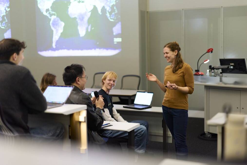 Professor speaking to students in classroom