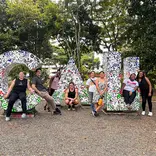 CET Colombia study abroad students pose in front of giant letters spelling "Cali"