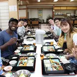CET Japan study abroad students and local roommates enjoy lunch in a restaurant