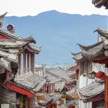 red buildings and roofs with mountain