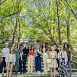 group smiling in the trees
