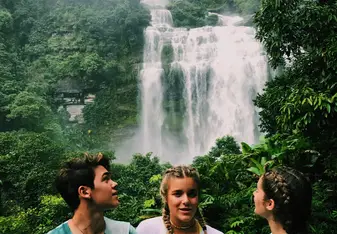 Looking at a waterfall from the vantage of a treehouse deck