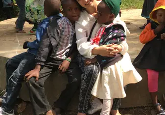 Volunteer with group of kids