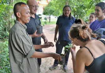 Exploring an herbal medicine doctor's garden, at a wat in Yasiton