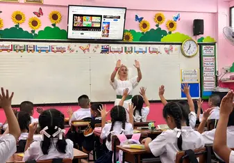 Teacher teaching Infront of the class