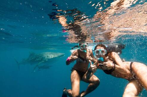 girls underwater snorkeling