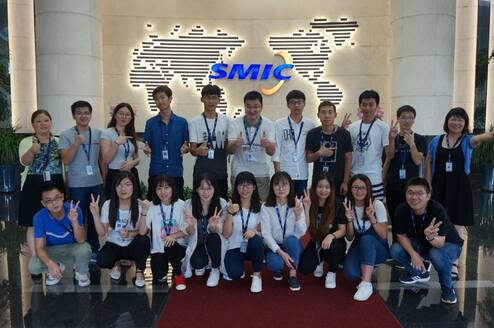 interns from internship in china program happily taking photos with co-workers in SMIC