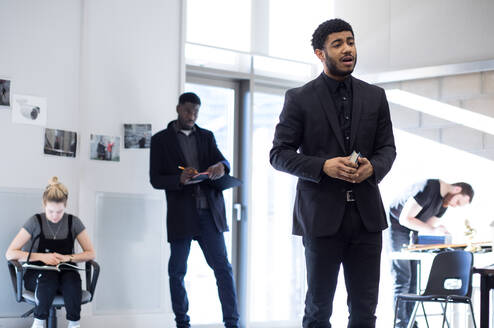 Actors rehearsing in a sunny studio