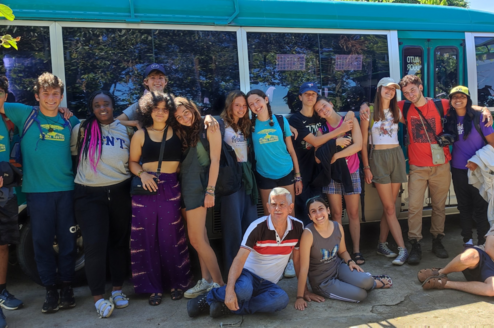 students group photo at the bus 