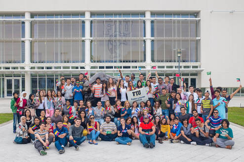 Group shot of FIU ELI students holding their country's flags.