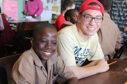photo of volunteer and young male student