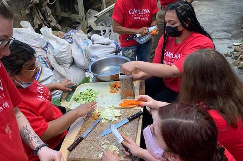 volunteers preparing food at the soup kitchen