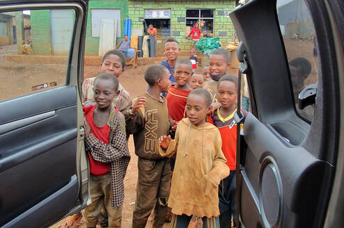 the children are welcoming  their teacher 