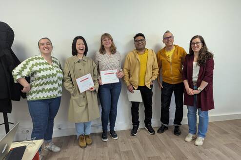 Students and teachers celebrating during the certificate distribution ceremony at the end of the course.