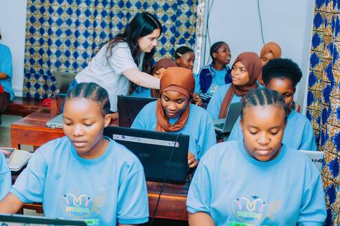 One of our interns at the class, training girls computer