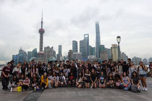 Gap students with Shanghai skyline behind them
