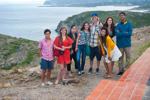 Group of students pose for photo on coast of Spain