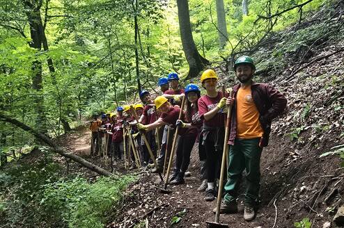 Our international volunteer crew on their way back to camp after a long day of hard, rewarding trail work