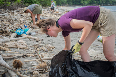 Volunteers collecting waste during a beach clean-up in Costa Rica