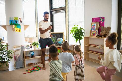 Teacher playing Simon Says with kids