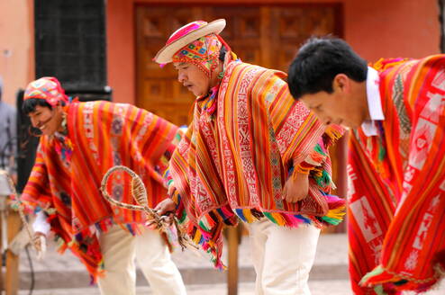 Men in traditional clothing in Peru.