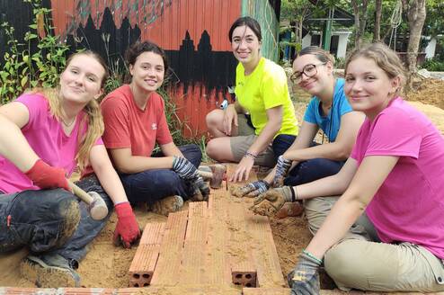 Volunteers in Cambodia building 