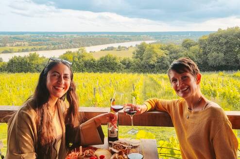 Enjoying at a vineyard restaurant while practicing French during an immersion experience in southwest France