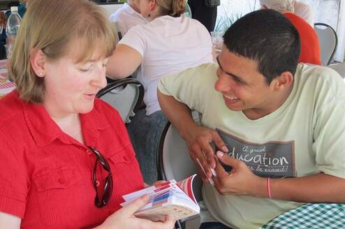 Teach English to youth and adult students.
