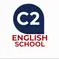 The logo shows a dark blue speech-bubble shape pointing downward. Inside it, the white text “C2” appears in bold. Below the speech bubble, the words “ENGLISH SCHOOL” are written in uppercase deep red letters, stacked over two lines. The design is simple, modern, and easy to read.