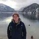 man standing by lake