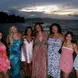 Katie poses with friends in front of ocean