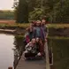 Clara and friends pose for a photo on a lake dock