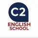 The logo shows a dark blue speech-bubble shape pointing downward. Inside it, the white text “C2” appears in bold. Below the speech bubble, the words “ENGLISH SCHOOL” are written in uppercase deep red letters, stacked over two lines. The design is simple, modern, and easy to read.