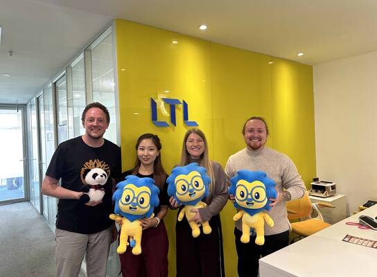 Students at LTL Beijing with Lex the Lion