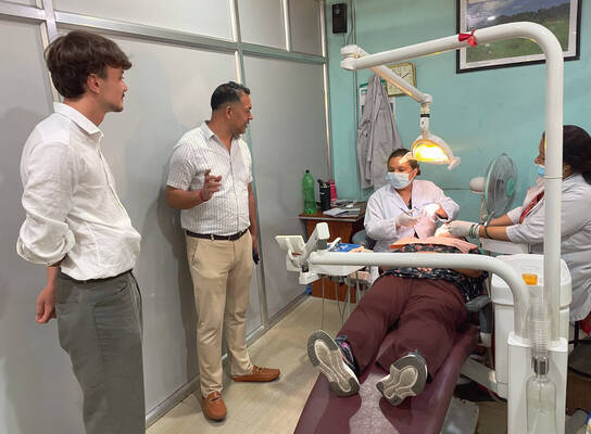 Nepal Dental Interns performing a checkup on a patient