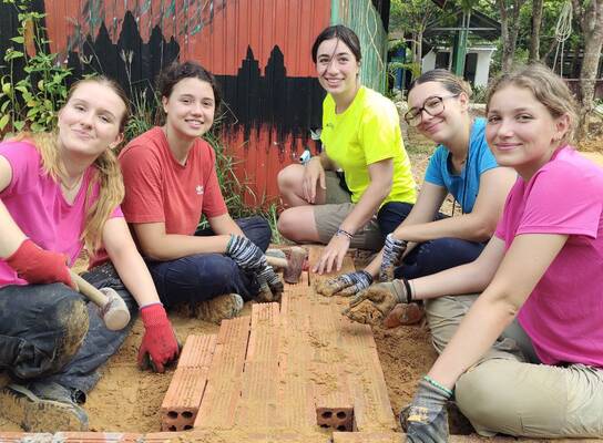 Volunteers in Cambodia building 