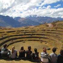 students looking at ruins in Peru