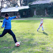 boy playing soccer