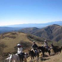 mountains in Argentina with riders on horseback 