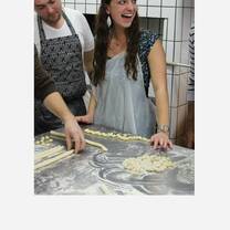 students making pasta in kitchen