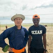 student and Mongolian farmer