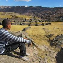 student looking out on ruins in Peru