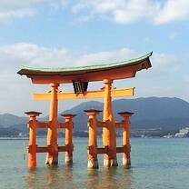 Japanese arch standing in the middle of water