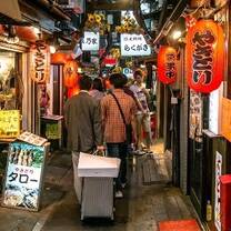 people walking through Japanese market