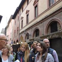 Group of male and female adult students in the street of Bologna, Italy