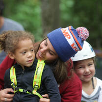 A summer Camp participant in Canada with campers